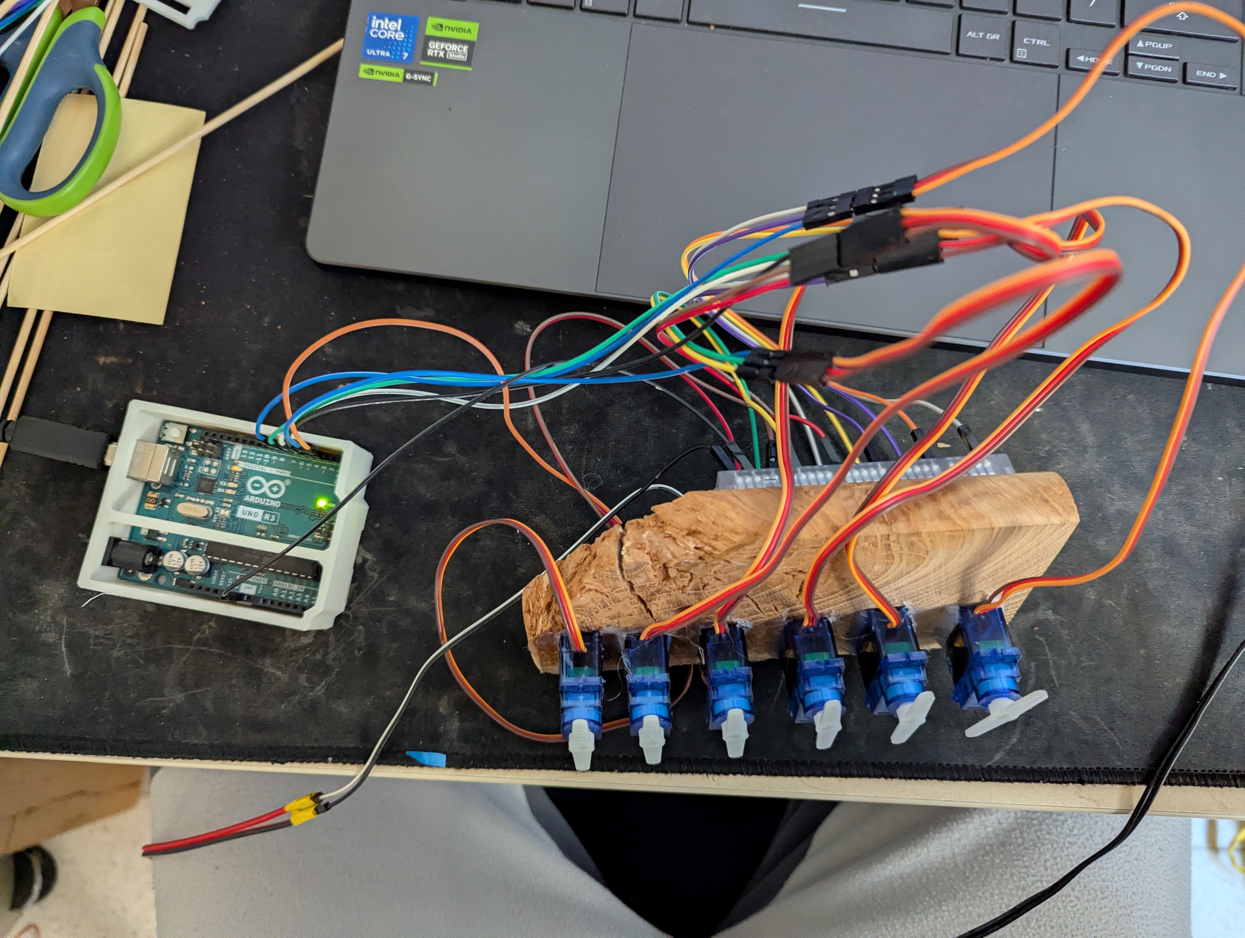 Early experiments with wood and servos. Resistance is information.